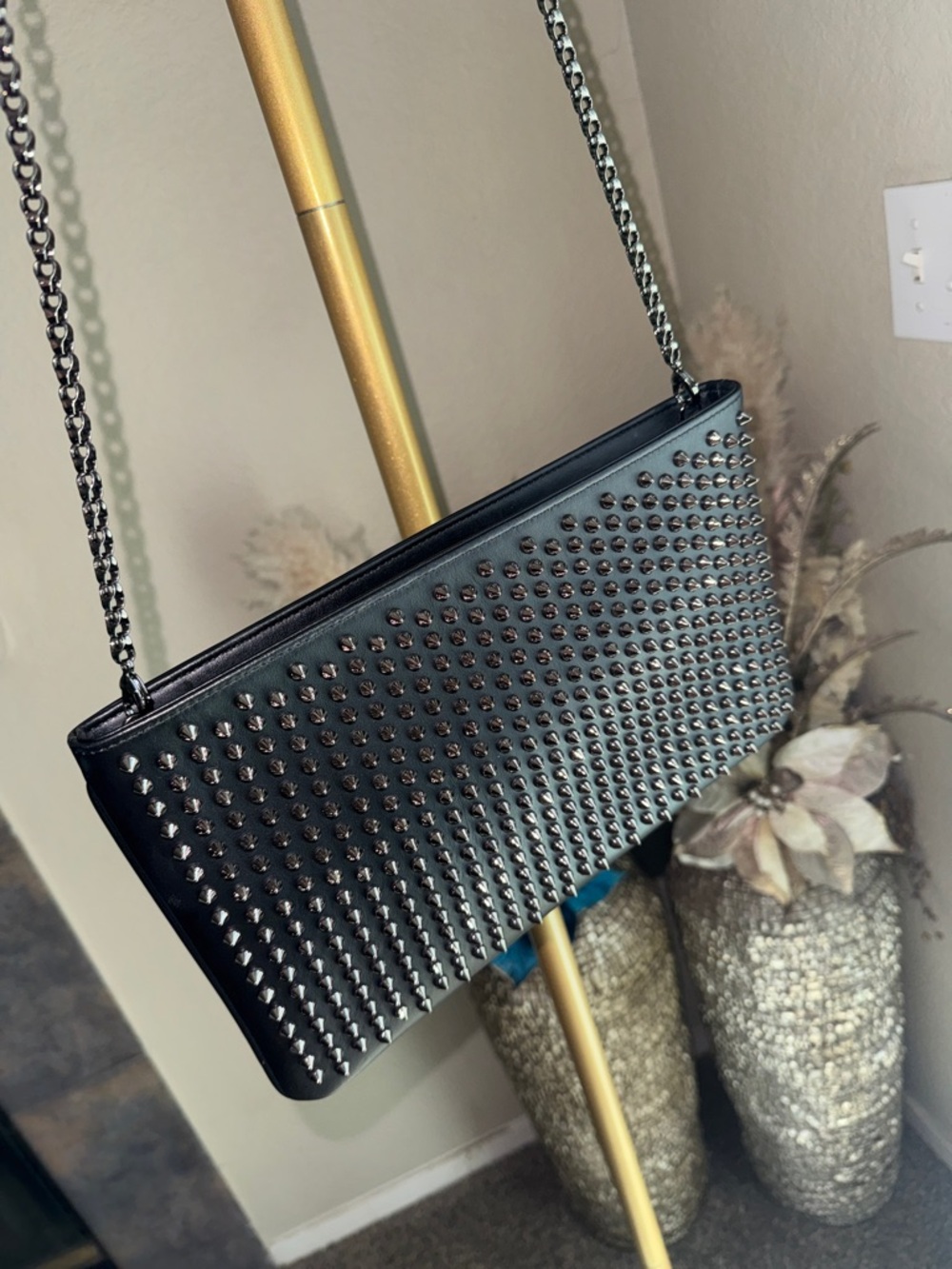 Christian Louboutin Loubiposh NV clutch in black calfskin with gunmetal spikes